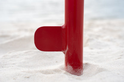 Custom red aluminum surf fishing rod holder beach spike stabilizer close up