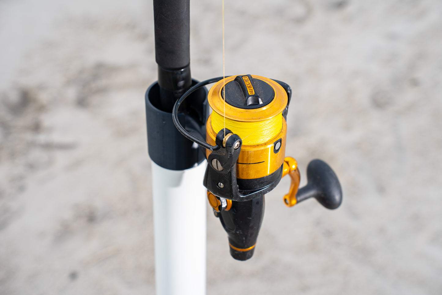 Custom white aluminum surf fishing rod holder beach spike black 3d printed cap close up with fishing rod inside