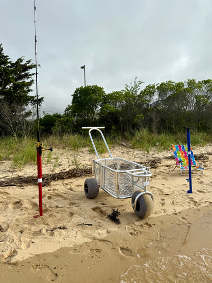 Angler surf fishing buggy, custom aluminum surf fishing cart with rod holders for fishing poles and space for beach gear. also featuring red and blue surf fishing rod holder beach spikes