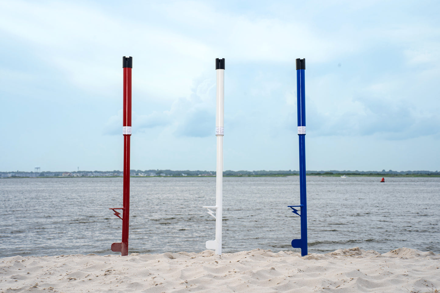 3 surf fishing rod holders RHSS in the sand in southern new jersey custom made quality aluminum fishing gear